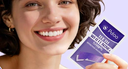 a person holding a purple pack of teeth whitening strips 