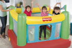 children jumping a Fisher-Price bounce house