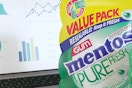 mentos spearmint gum value pack near a laptop