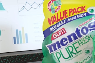 mentos spearmint gum value pack near a laptop
