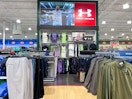 The Under Armour section of a Dicks Sporting Goods store