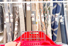 target cart parked in front of outdoor area rugs on a shelf