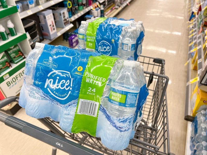 packs of water bottles in shopping cart