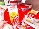 hand holding a rubbermaid bowl set in front of target shelves