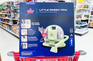 bissell little green mini carpet cleaner sitting on top a target cart