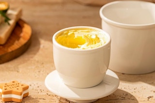 a french butter crock on a table