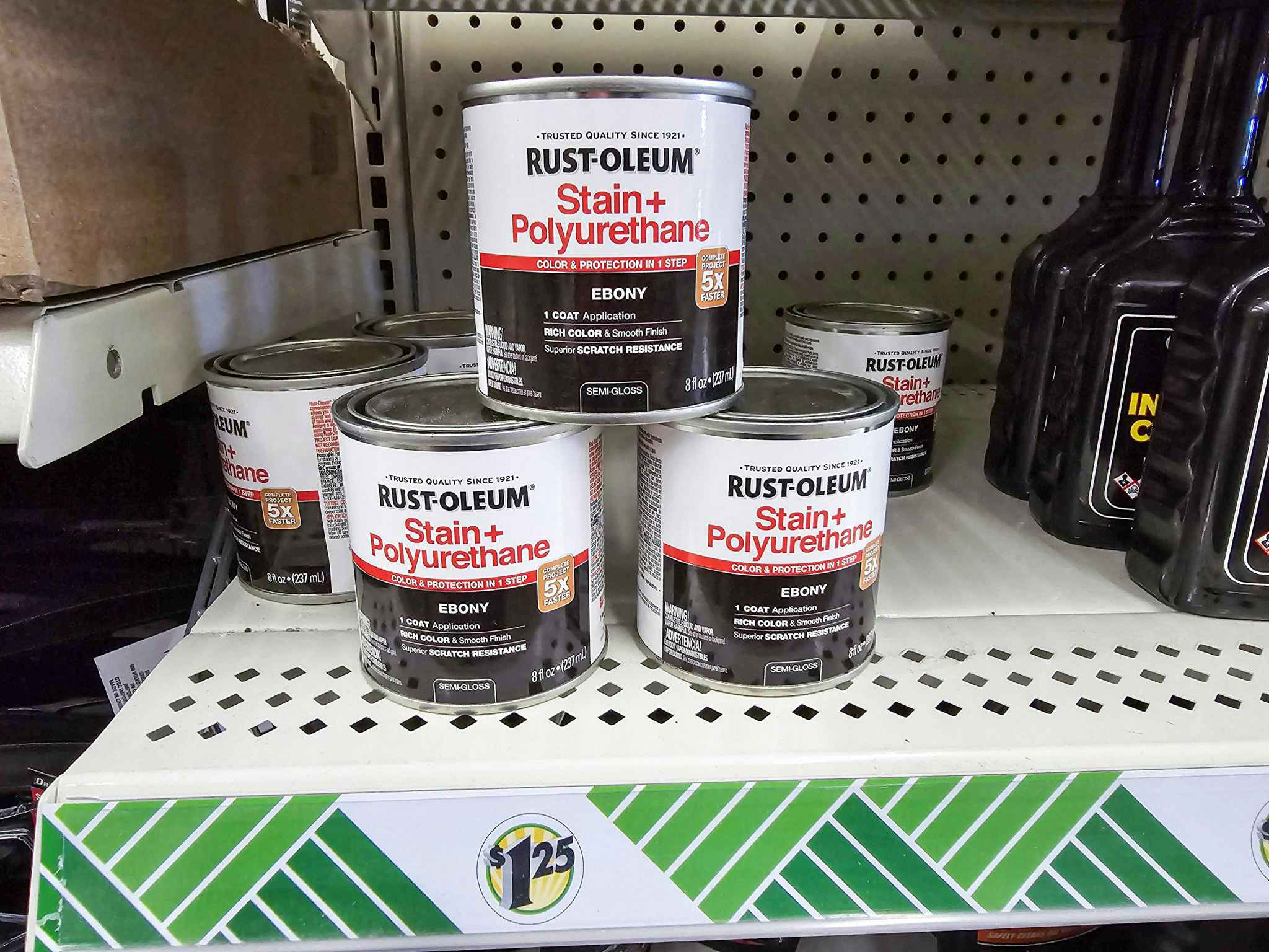 cans of rustoleum stain and polyurethane on a shelf