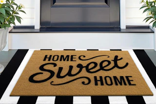 front doormat with the print "home sweet home"