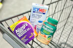 allegra, icy hot, and dulcolax in a shopping cart