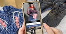 Someone holding a phone displaying the Depop app in front of some clothing and shoes
