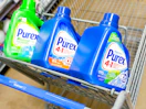3 Purex laundry detergents in front part of Walmart shopping cart