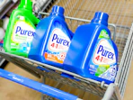 3 Purex laundry detergents in front part of Walmart shopping cart