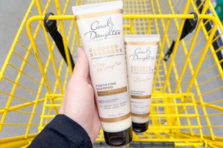 hand holding carol's daughter shampoo