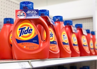 bottle of tide detergent on shelf facing the camera