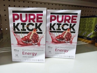 boxes of pure kick hydration singles on a shelf