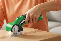 a woman using a box cutter