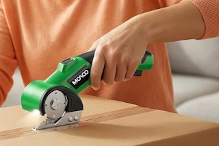 a woman using a box cutter