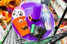 halloween party supplies in cart at dollar tree
