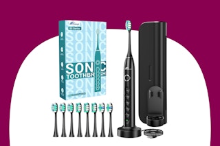 A black wireless electric toothbrush with 8 extra heads and a box to the left of it, a travel case to its right.