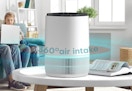 white air purifier on a coffee table