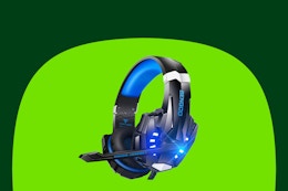 A blue and black gaming headset with a visible microphone, a padded band, and lighted earpieces