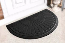 Lifestyle image of a black half round doormat in front of door outside