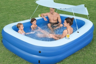 a family in an inflatable pool