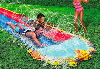 boys sliding on body boards