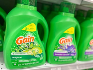 A row of Gain detergent on a store shelf.