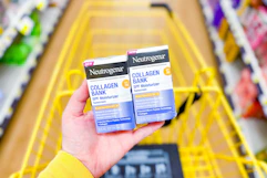 hand holding neutrogena collagen bank moisturizers