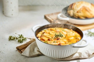 Lifestyle image of the white Tramontina 4-quart Cast Iron Dutch Oven