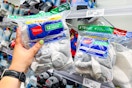 hand grabbing a hanes kids socks 12-pair pack off a target shelf