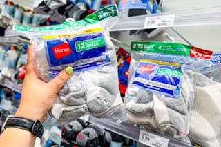 hand grabbing a hanes kids socks 12-pair pack off a target shelf