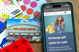 gift cards on a table next to a phone
