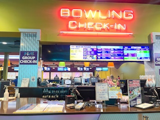 bowling alley check in sign 
