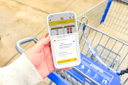hand holding a smartphone displaying a 1-clip coupon deal in the kcl app