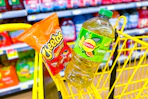 lipton and cheetos in a yellow shopping cart