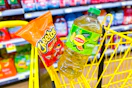 lipton and cheetos in a yellow shopping cart
