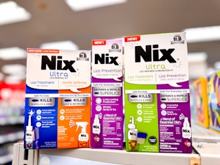 three bottles of nix lice prevention on cvs counter