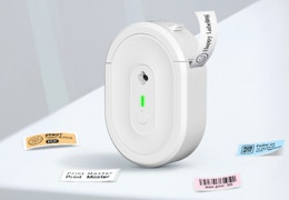 a teal label maker next to labels and jars 