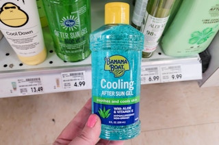 hand holding a bottle of banana boat after sun cooling gel at kroger