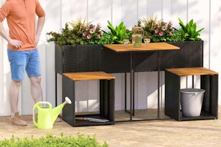 Lifestyle image of the Costway Patio Furniture with Raised Garden Bed with a man standing off to the side