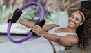 a person doing pilates with a pilates ring
