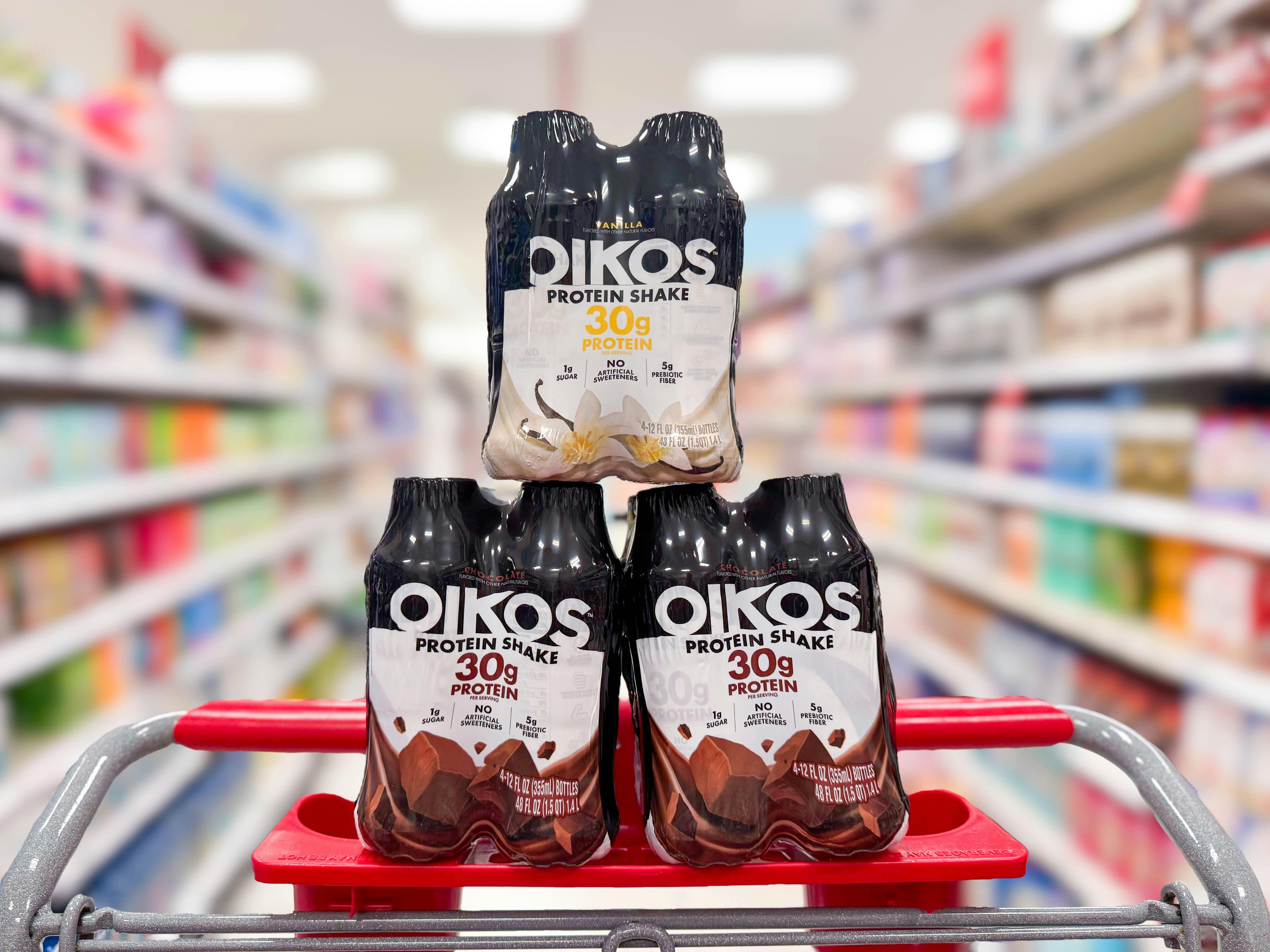 3 oikos protein shakes 4-packs sitting on top a target cart