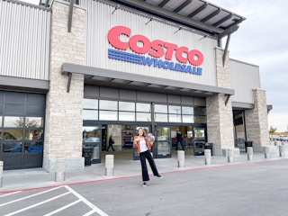 costco storefront with heather standing in front