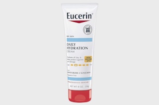 a tube of sunscreen on a light grey background