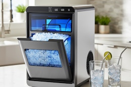 large ice maker with a couple of glasses