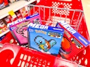 3 mega pokemon sets sitting in a target cart