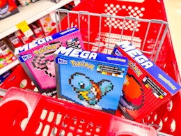 3 mega pokemon sets sitting in a target cart