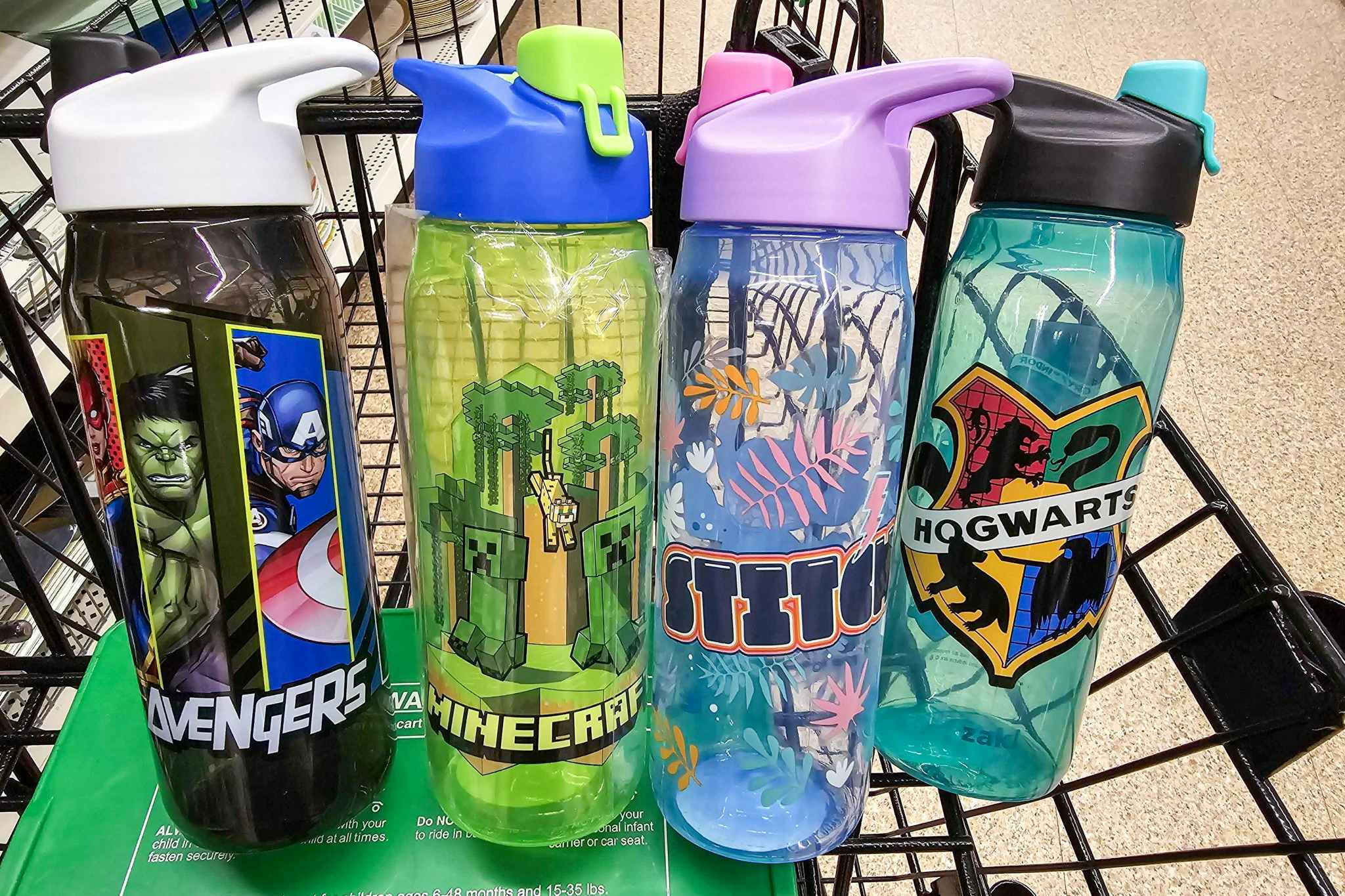 4 licensed character water bottles in a cart
